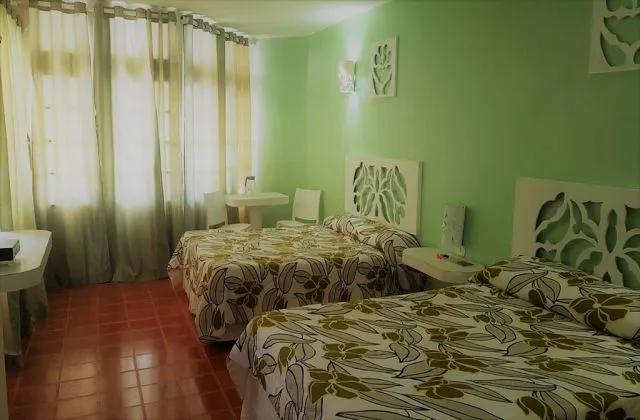 Hotel Costa Larimar bedroom 2 king bed